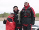 Governor Pawlenty shows off his first catch of the year to the approval of his guide Mike 
