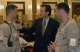Governor Pawlenty talks with Air Force Cpt. Jim Annexstad and Air Force Maj. Tim Tuttle, both attorn...