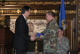 Governor Pawlenty presents the Minnesota Flag to Lt. Col. Mark Hoberg, the Commanding officer of the...