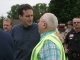 Governor Pawlenty discusses flood recovery efforts with a member of the Rushford City Council -- Aug...