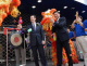 Governor Pawlenty hits a gong, signaling the ceremonial opening of the Shanghai Best Buy, the compan...