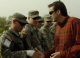 Governor Pawlenty awards Spc. Michael Anderson, of Anoka, Minn., the Governor's Coin after Anderson ...
