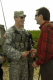Governor Pawlenty shares a laugh with 1st Lt. Zachary Cegleski, of Truman, Minn., during his trip to...