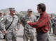 Governor Tim Pawlenty speaks with SSG Adam Sands, from Albert Lea, Minn., and SSG Paul Robinson, fro...