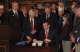 Governor Pawlenty shares a laugh with veterans and legislators after signing S.F. 3683, the Omnibus ...