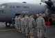 Governor Pawlenty greets 34th Infantry Division leaders as he exits a 133rd Airlift Wing C-130 Hercu...