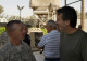 Governor Pawlenty visits with Petty Officer First Class Sik at the Phoenix Base in Baghdad, Iraq.  G...
